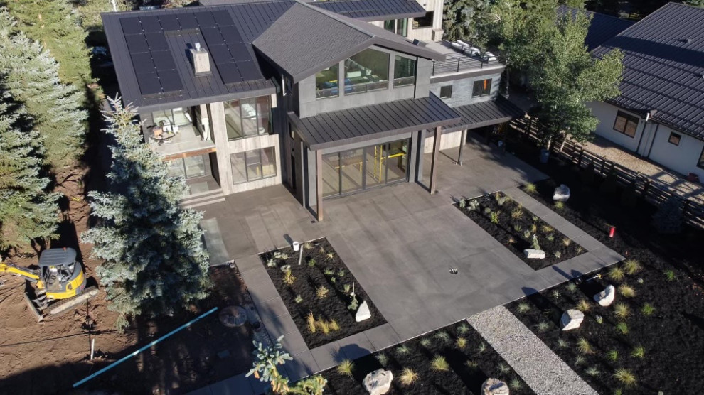 Luxury outdoor living space in Utah with custom pool, fire features, and mountain views
